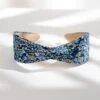 Mallorie's Cool Blue Floral Wide Fabric Headband 1 Mallorie's Cool Blue Floral Wide Fabric Headband -Laurel Mercantile Store Mallorie scoolbluefloralheadband Knotted WebsiteImages June24 2024 0004